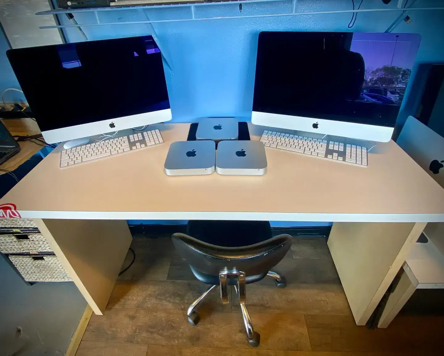 macbooks on top of white desk