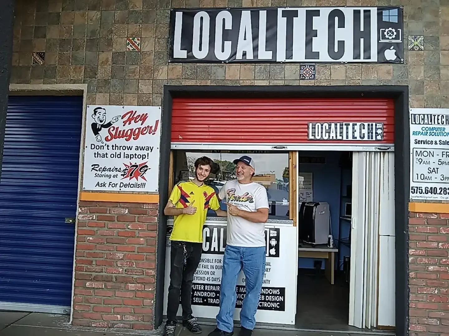 Owner and tech working standing in front of localTech